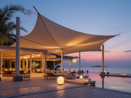 Large outdoor sun shelter canopy showing white fabric roof with aluminum frame structure, installed in backyard setting with people sitting underneath, modern design